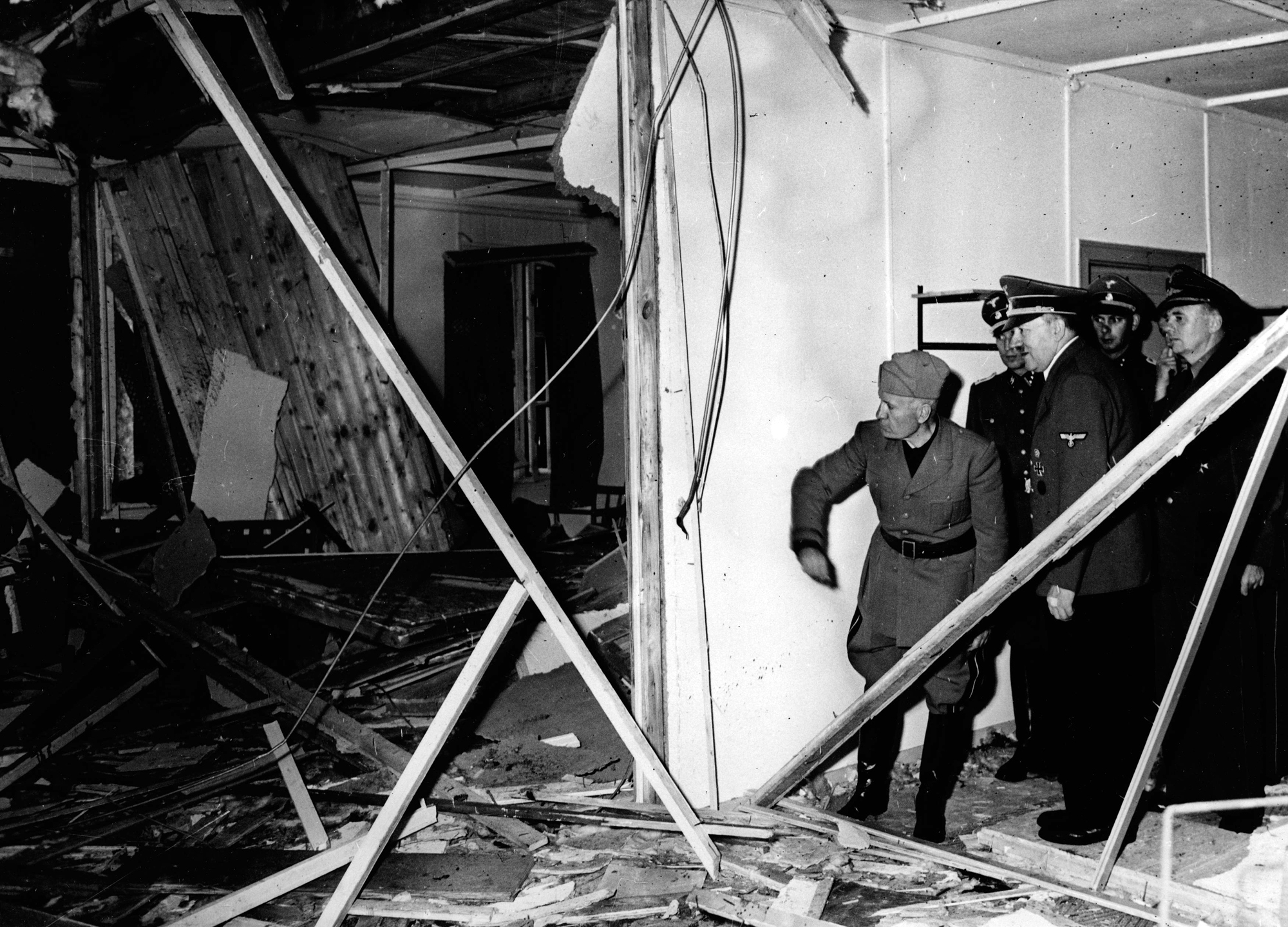 Mussolini and Hitler inspect the wreckage of the conference room